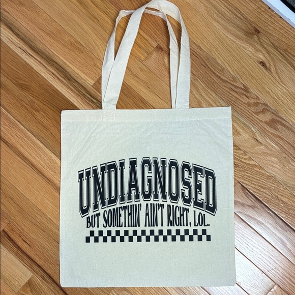 Beige Tote Bag with Black Text - Picture 1 of 3